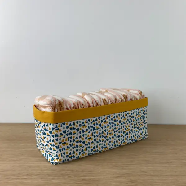 panière à couches rectangulaire permet d’organiser la table à langer