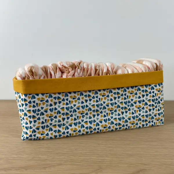 panière à couches rectangulaire permet d’organiser la table à langer